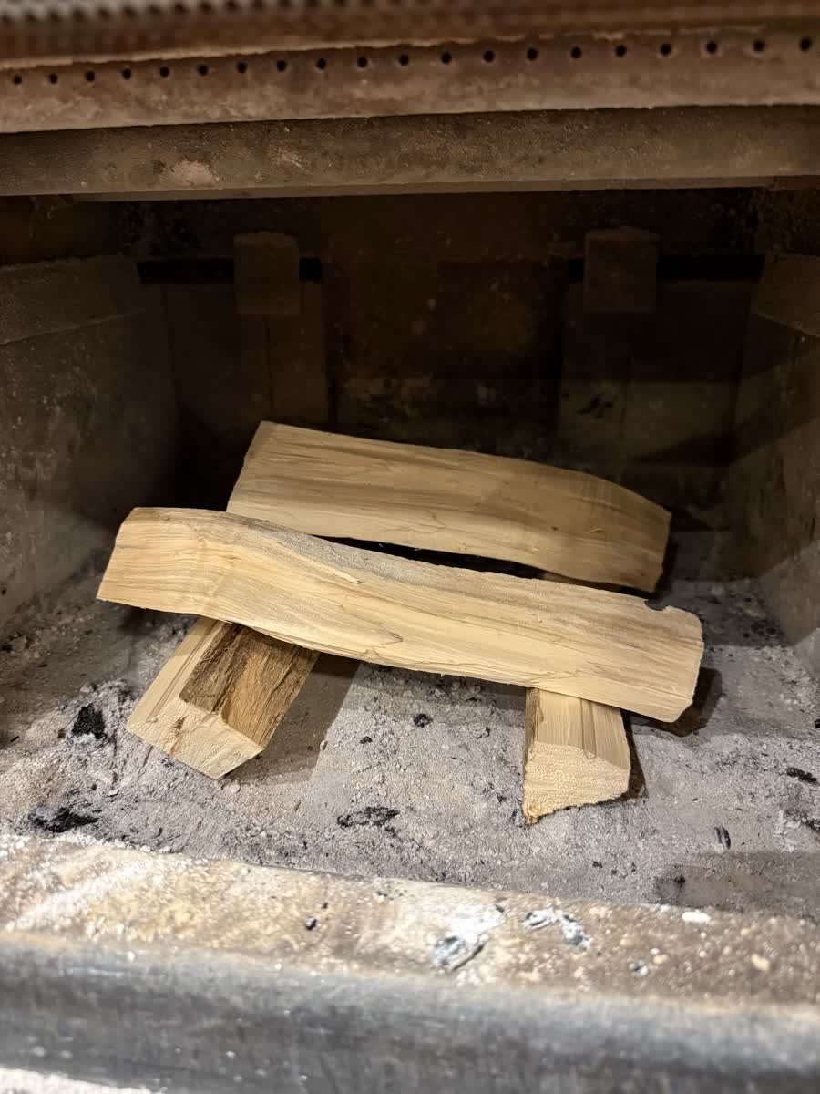 Two splits laid on the firebox floor