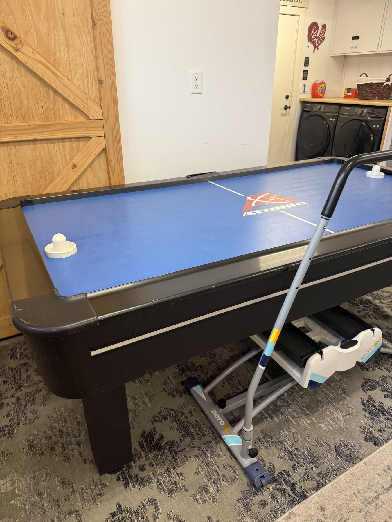 The Aero Ski tucked beside the air hockey table