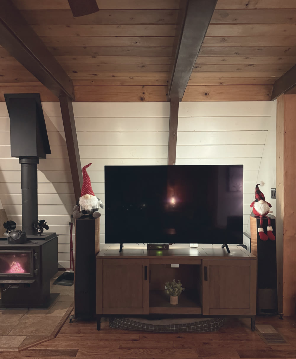 The stove room with two gnomes by the TV