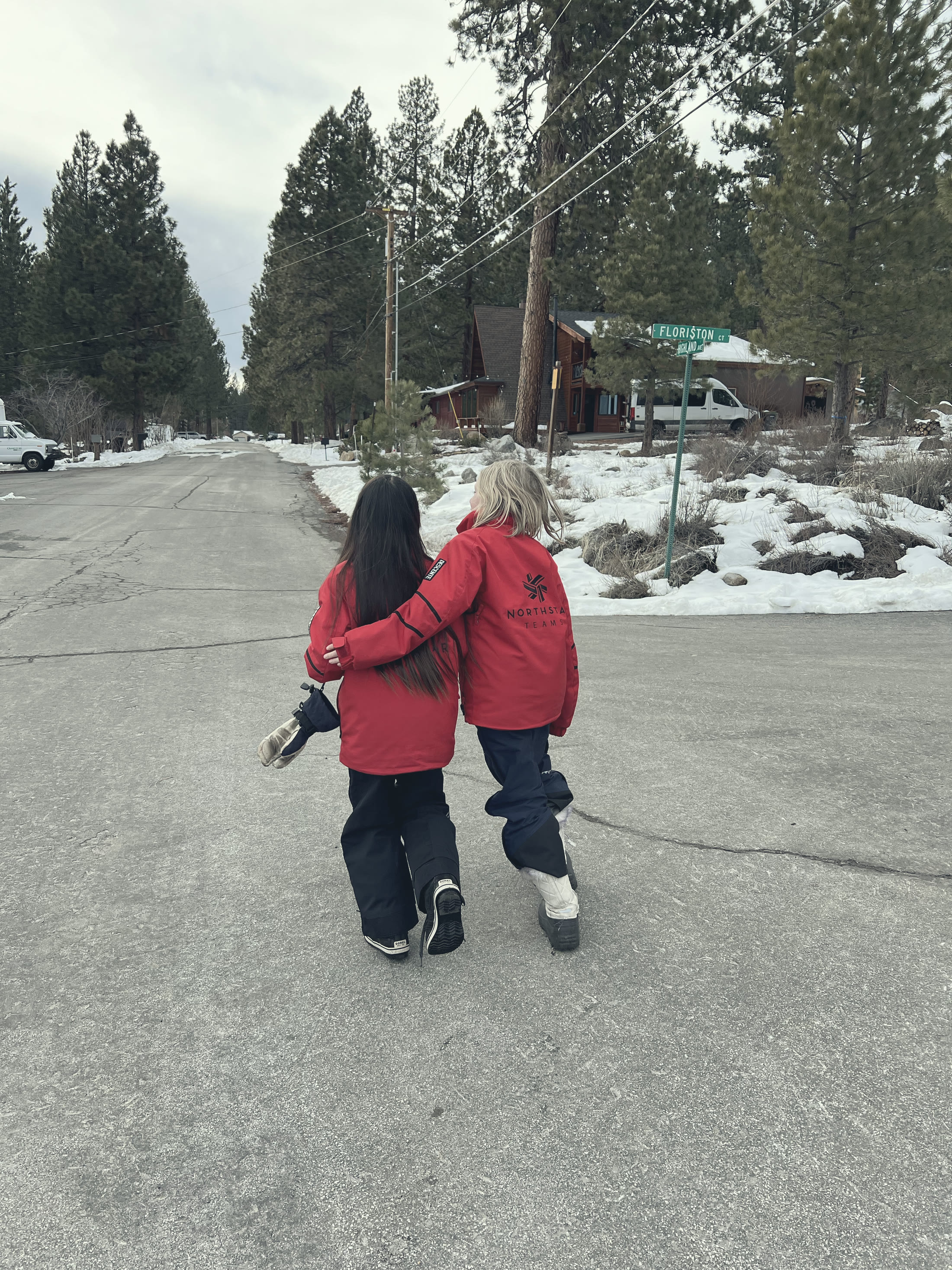 Walking arm in arm down the cleared road